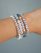 Elevated Faith Christian Jewelry Bracelet with inspiring words like Trust, Faith, and Grace on colorful beads