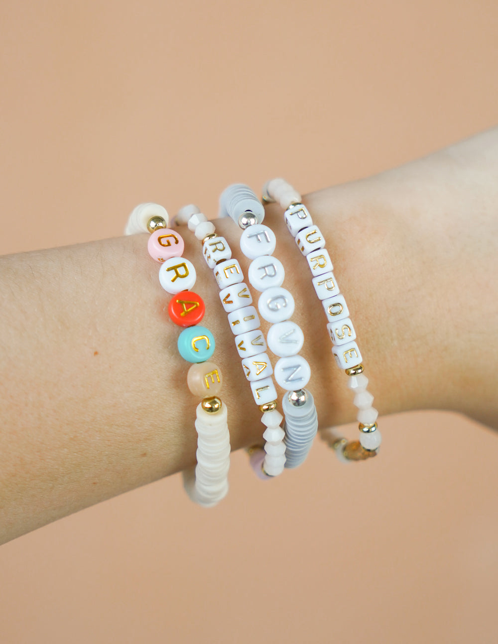 Set of colorful Elevated Faith Christian Jewelry Bracelet with beads spelling Grace, Revival, and Purpose