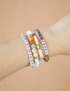 Colorful Elevated Faith Christian Jewelry Bracelet stacked with inspiring words and vibrant beads