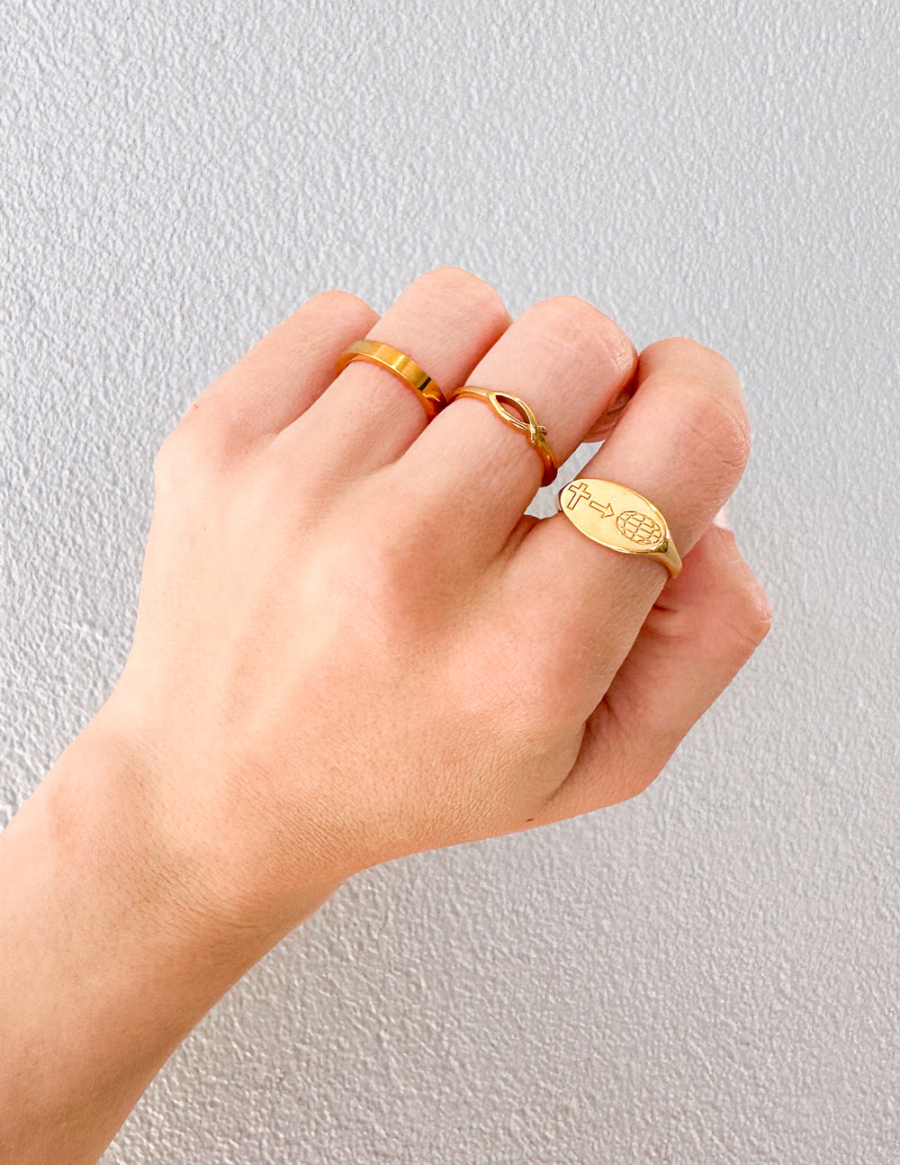 Gold Elevated Faith Christian Jewelry rings worn on fingers showcasing unique designs