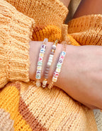 Elevated Faith Christian Jewelry Bracelet with colorful letter beads spelling Miracles and Prosperity