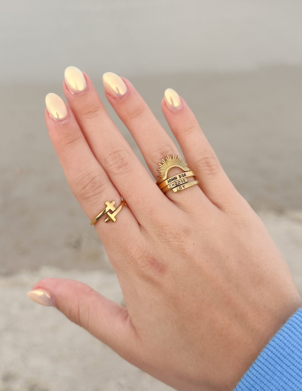 Elevated Faith Christian Jewelry Gold Ring Set Featuring a Cross and Sunburst Design
