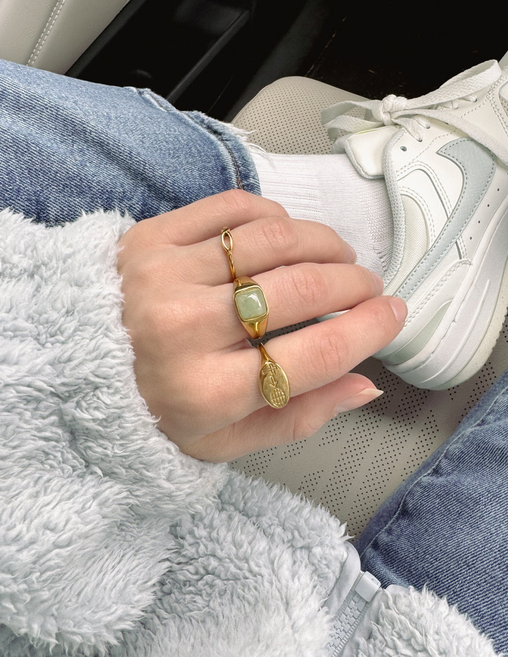 Elevated Faith Christian Jewelry Ring with Green Stone and Gold Accent on Hand