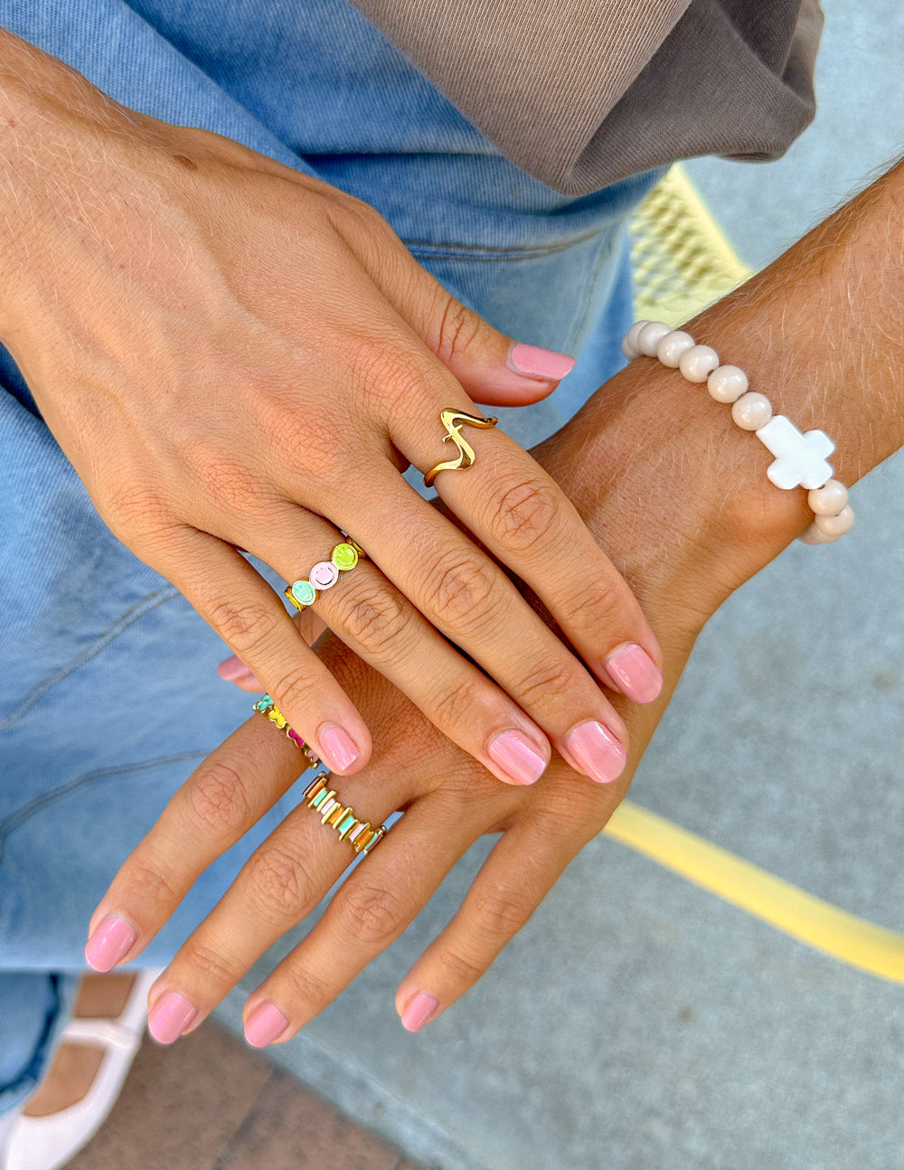 Elevated Faith Christian Jewelry featuring multiple stylish rings worn on fingers
