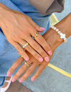 Elevated Faith Christian Jewelry featuring multiple stylish rings worn on fingers