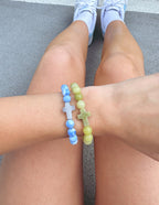 Elevated Faith Christian Jewelry Bracelet set featuring blue and green stone designs with cross accents