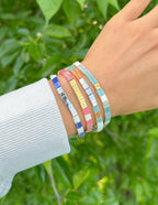 Elevated Faith Christian Jewelry Bracelet with colorful letter beads stacked on a wrist