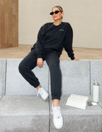 Elevated Faith Christian Crewneck Sweatshirt in black, styled for a relaxed look with matching sweatpants