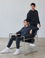 Two models wearing Elevated Faith Christian Crewneck Sweatshirt in dark color, showcasing comfort and style
