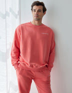 Elevated Faith Christian Crewneck Sweatshirt in vibrant coral color for casual comfort and style