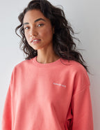 Elevated Faith Christian Crewneck Sweatshirt in coral color featuring a soft, relaxed fit