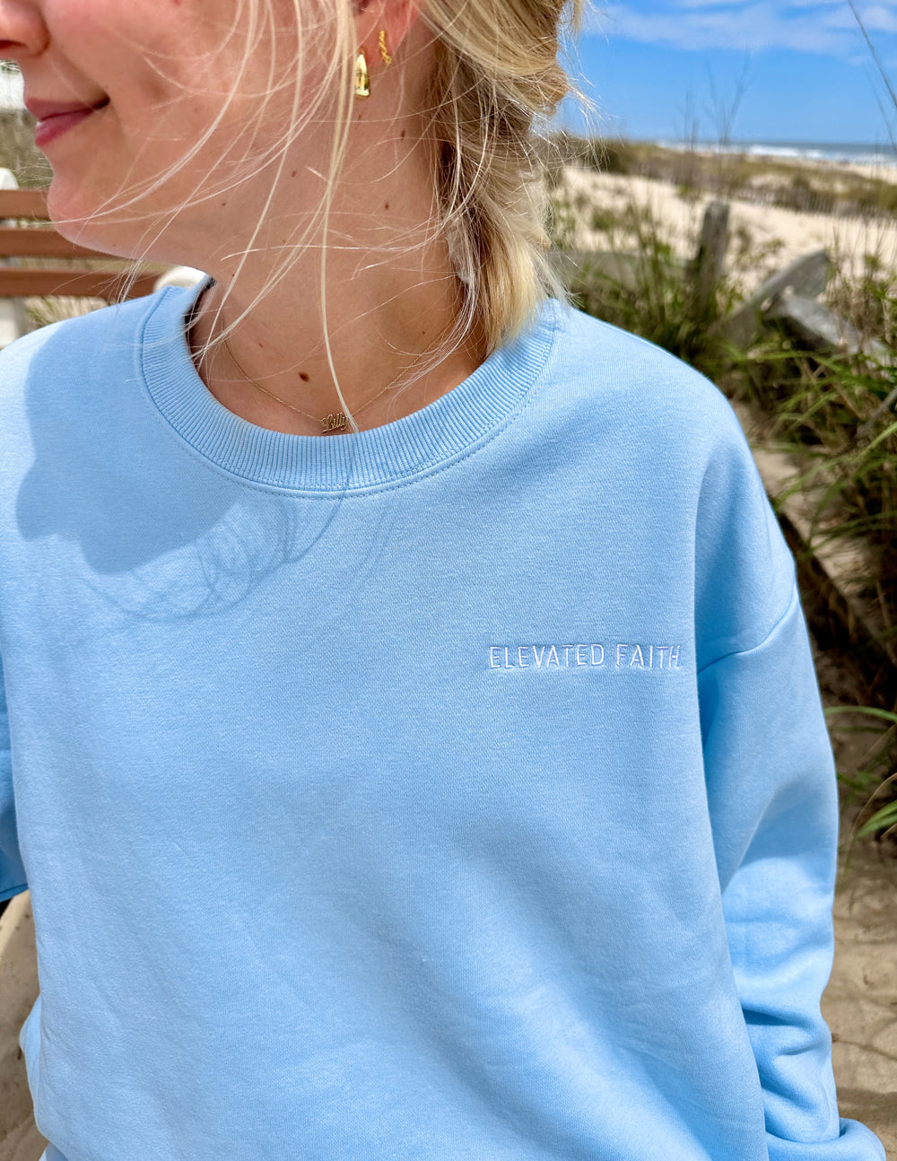 Light blue Christian Crewneck Sweatshirt by Elevated Faith with embroidered logo detail