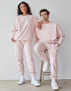 Couple wearing matching pink Elevated Faith Christian Crewneck Sweatshirt with relaxed fit and comfort