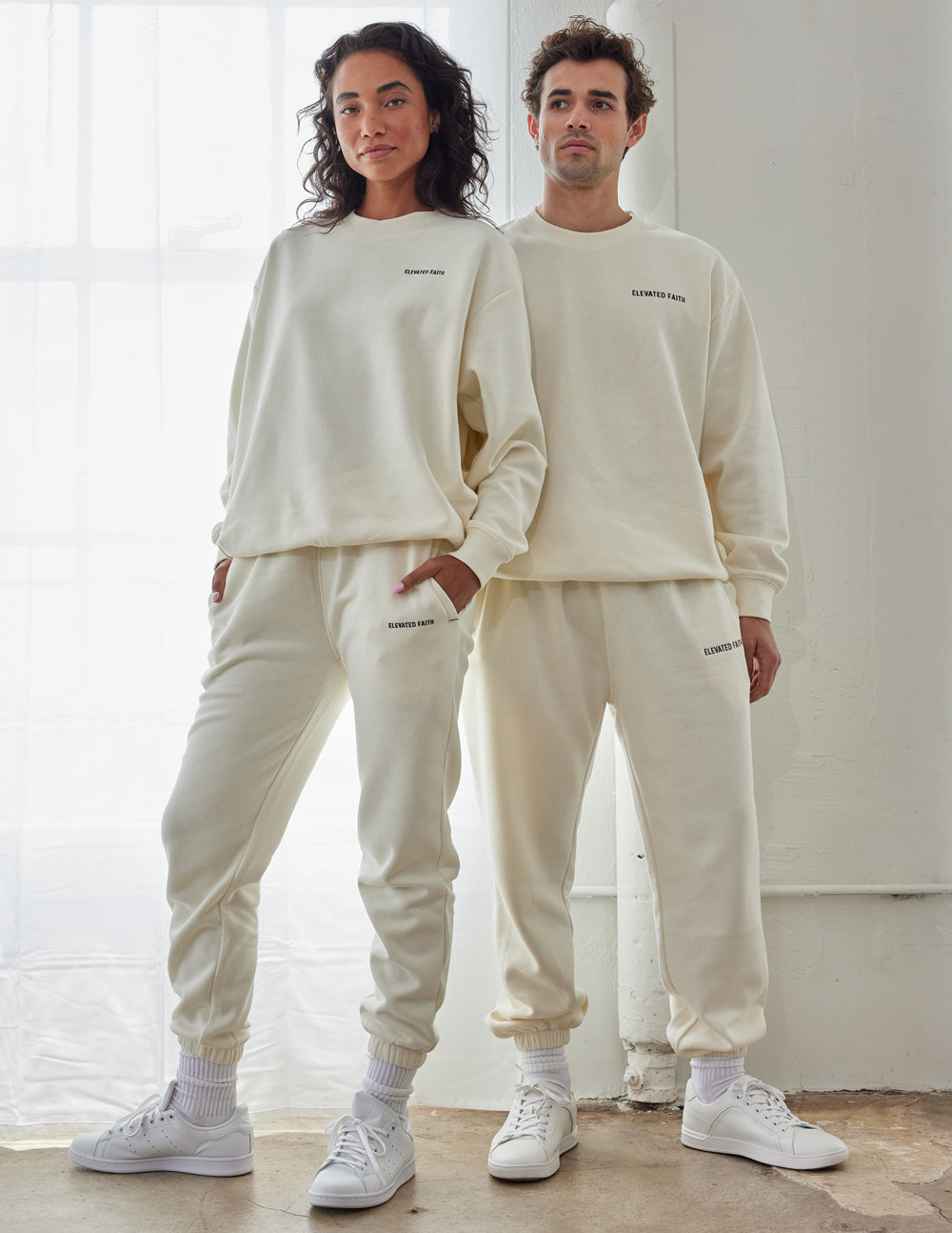 Elevated Faith Christian Crewneck Sweatshirt in neutral color worn by a man and woman