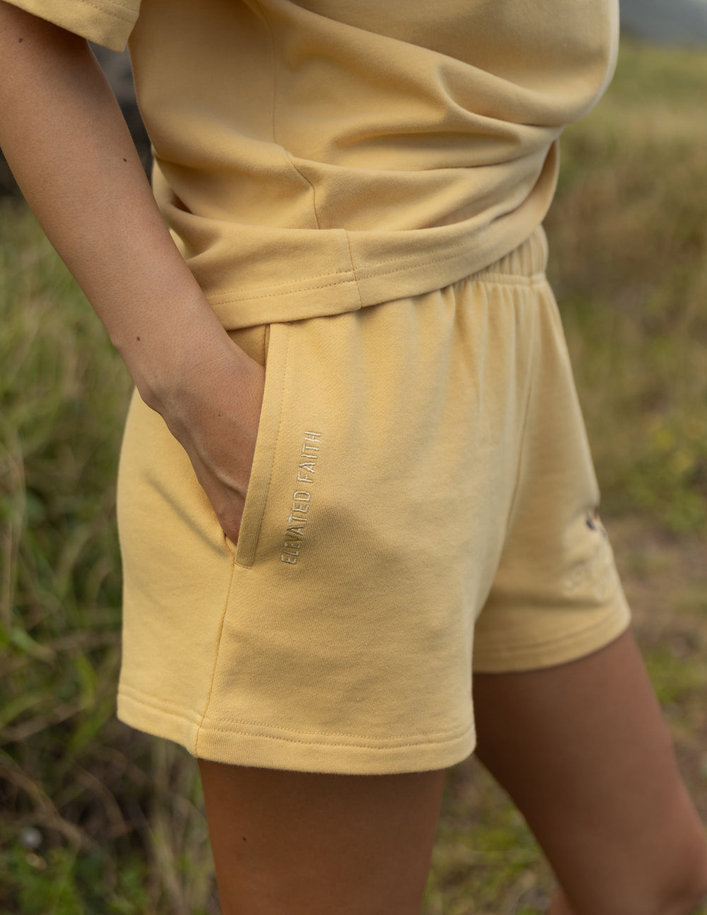 Elevated Faith Christian Shorts in Soft Yellow Color with Side Pockets and Comfortable Fit
