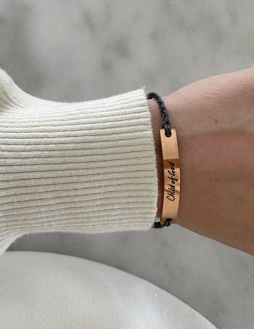Elevated Faith Christian Jewelry Bracelet with a copper tag and braided string for a stylish faith accessory