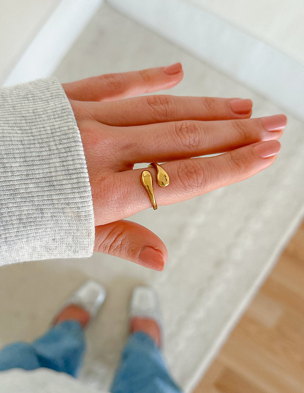 Stylish gold ring from Elevated Faith representing faith as Christian Jewelry worn on a hand