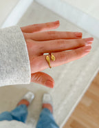 Stylish gold ring from Elevated Faith representing faith as Christian Jewelry worn on a hand