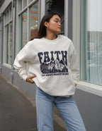 Elevated Faith Christian Crewneck Sweatshirt featuring mountain design and bold faith statement