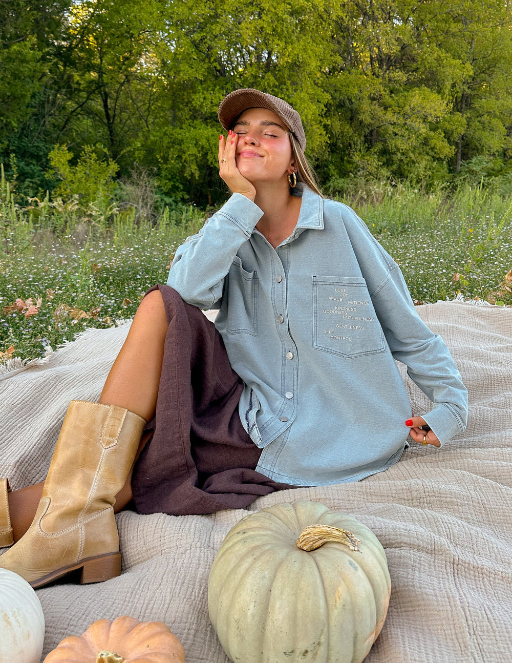 Elevated Faith Christian Jacket in light blue, styled with a cozy outfit and boots outdoors