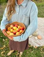 Elevated Faith Christian Jacket in light denim, styled for a cozy autumn vibe with a basket of apples