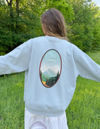 Elevated Faith Christian Crewneck Sweatshirt with scenic mountain design on the back