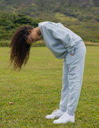 Light blue sweatpants from Elevated Faith featuring 'God is Never' design, perfect for Christian Apparel