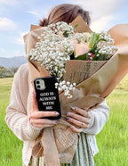 Christian iPhone Case with the phrase God is Always With Me held by a woman with a bouquet of flowers