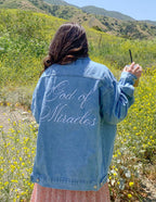 Elevated Faith Christian Jacket featuring 'God of Miracles' embroidery on the back in denim fabric