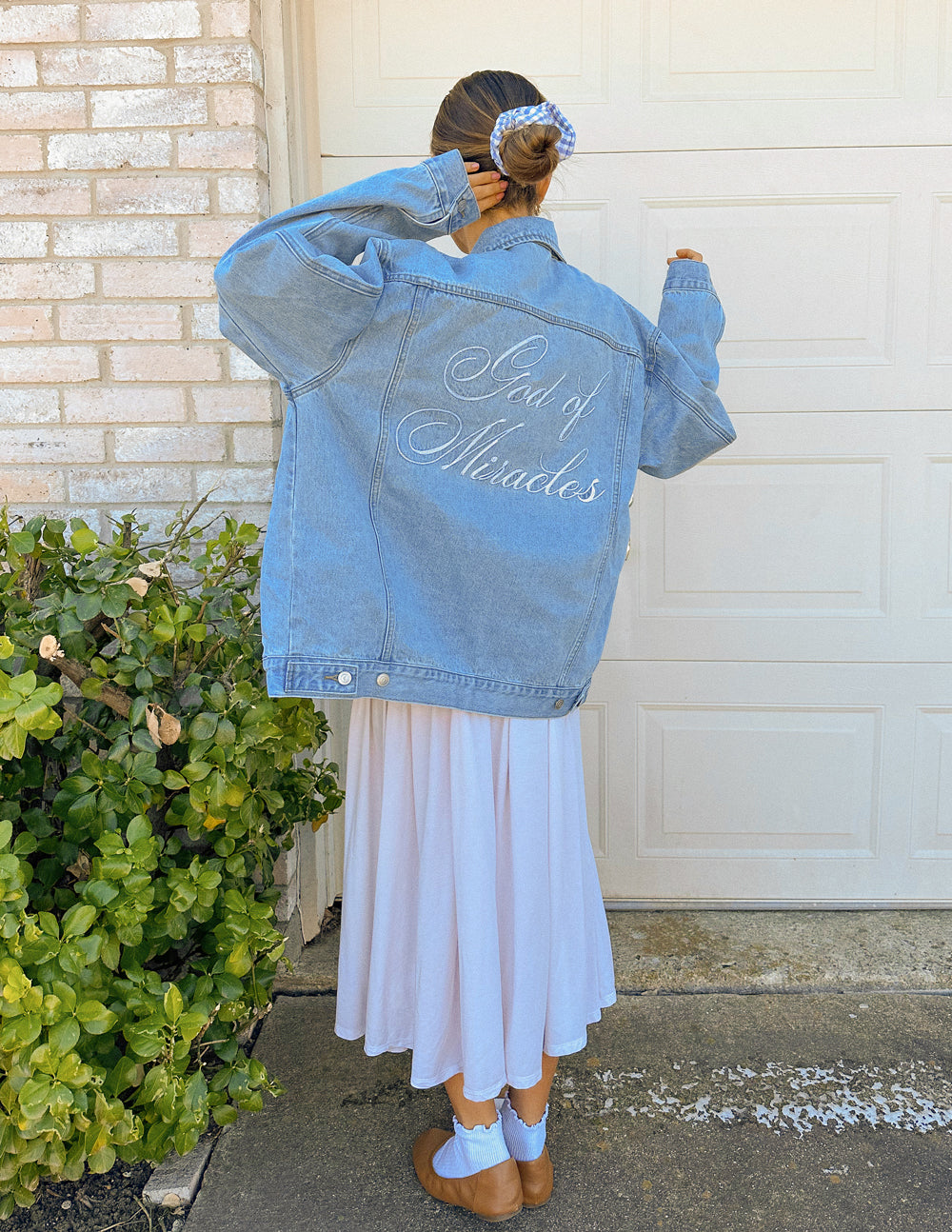 Denim Christian Jacket from Elevated Faith featuring 'Sea of Miracles' embroidery on the back