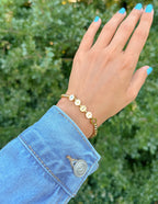 Elevated Faith Christian Jewelry Bracelet with gold letter charms spelling 'Faith' on a delicate chain