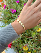 Elevated Faith Christian Jewelry Bracelet with gold letters on a delicate chain worn on a wrist