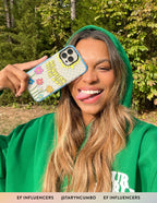 Colorful Christian iPhone Case with floral design and inspirational text held by a smiling woman outdoors