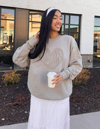 Elevated Faith Christian Crewneck Sweatshirt in beige with a subtle logo design, perfect for casual wear.