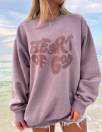 Elevated Faith Christian Crewneck Sweatshirt featuring 'Heart of God' graphic design in purple