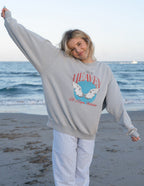 Elevated Faith Christian Crewneck Sweatshirt featuring a graphic design on a beach setting
