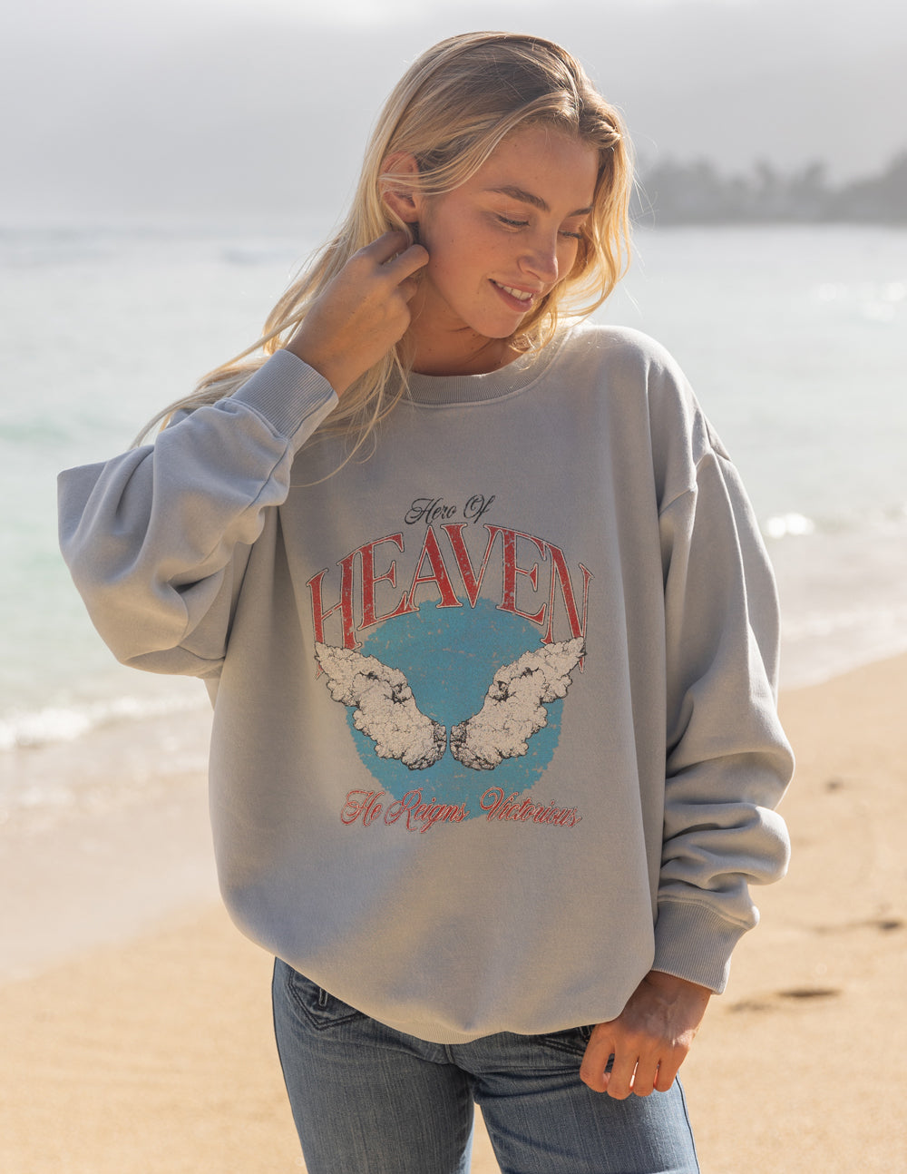 Elevated Faith Christian Crewneck Sweatshirt with Heavenly Wings Design on a Soft Gray Background