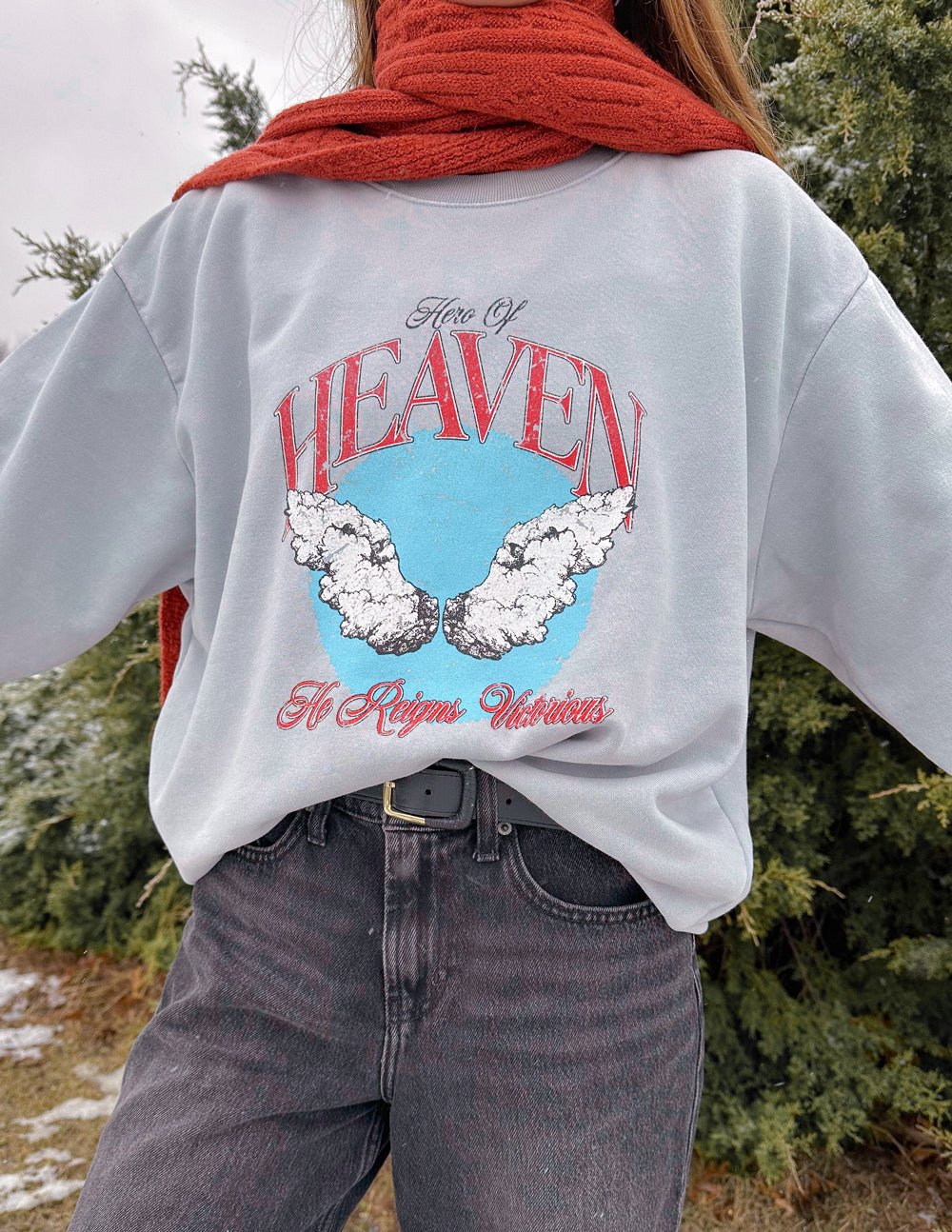Elevated Faith Christian Crewneck Sweatshirt featuring angel wings and a heaven graphic design