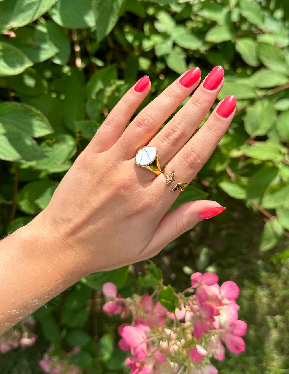 Elevated Faith Christian Jewelry Ring with a unique design showcased on a hand with bright pink nails