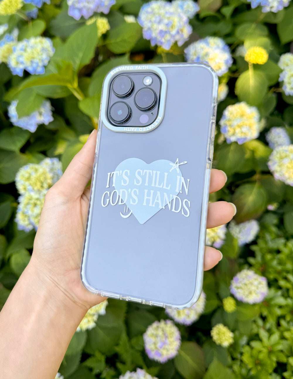 Christian Phone Case featuring the phrase It's Still in God's Hands on a clear background