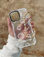 Transparent Christian iPhone Case by Elevated Faith with smiley face design and a decorative strap