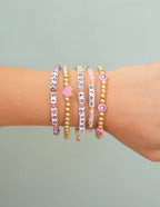 Colorful Christian Jewelry Bracelet set featuring inspirational letters and charms on a wrist