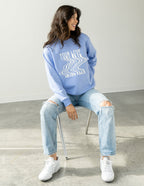 Elevated Faith Christian Crewneck Sweatshirt in blue with 'Your Love Never Fails' graphic design