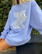 Light blue Christian Crewneck Sweatshirt featuring wavy text and a relaxed fit for comfort and style