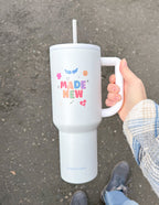 Elevated Faith Made New Tumbler with a vibrant design, perfect for Christian gifts.