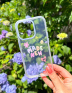 Elevated Faith Christian iPhone Case with colorful floral design and inspirational text 'Made New'