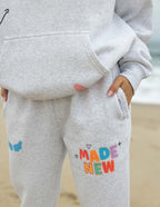 Elevated Faith Grey Sweatpants with 'Made New' Design, perfect for Christian Apparel wearers