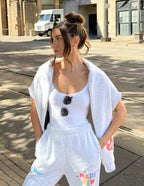 Elevated Faith cozy sweatpants in gray, featuring colorful 'Made New' design, ideal for Christian Apparel fashion.