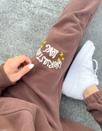 Brown Elevated Faith sweatpants for men and women featuring Christian Apparel design with cozy fit