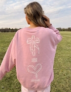 Pink Christian Crewneck Sweatshirt featuring a minimalist design with a cross and heart graphic